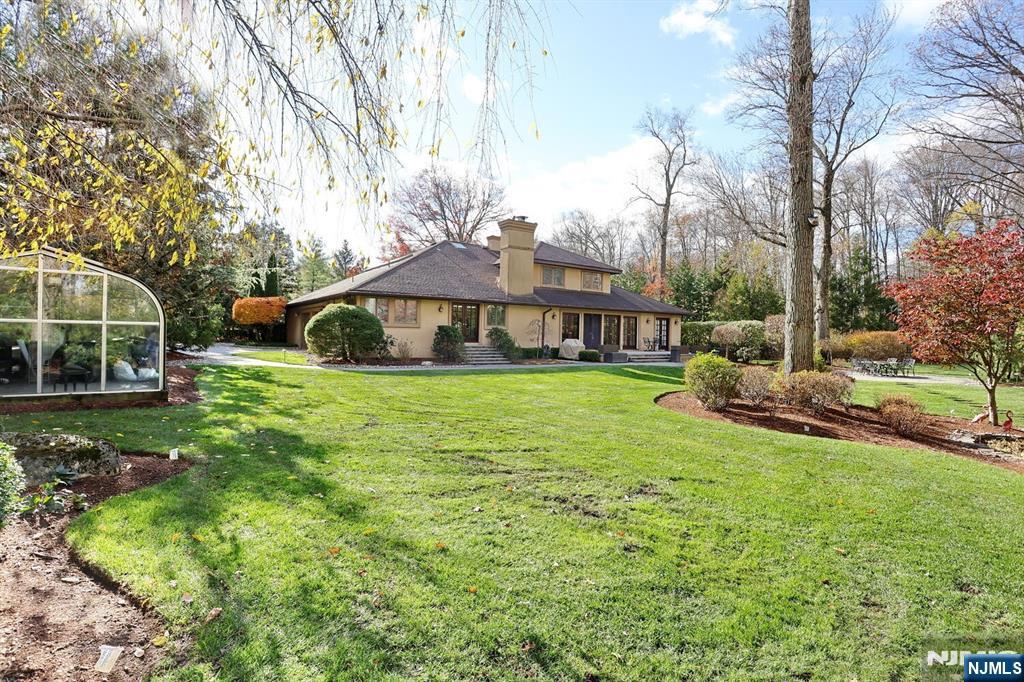 4 Summertree Way Montvale, NJ 07645 - Photo 36 of 50 a view of a house with a big yard and sitting area