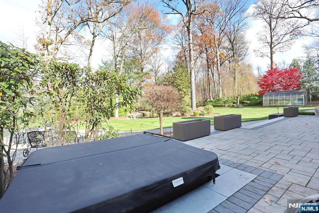 4 Summertree Way Montvale, NJ 07645 - Photo 38 of 50 a swimming pool with outdoor seating and yard