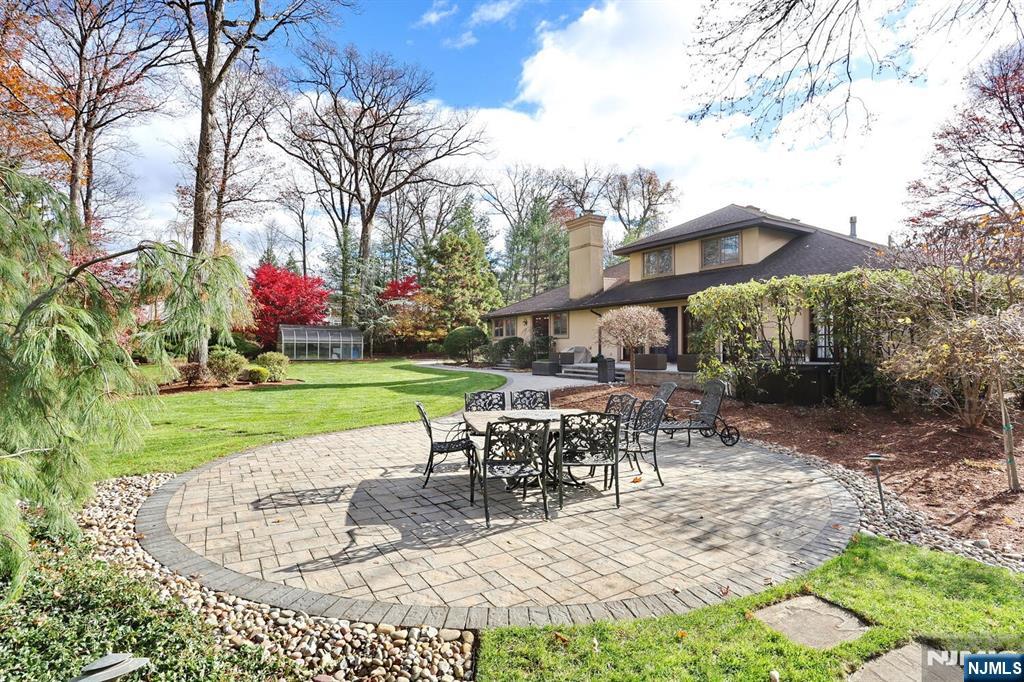 4 Summertree Way Montvale, NJ 07645 - Photo 40 of 50 a view of a sitting area with furniture and garden