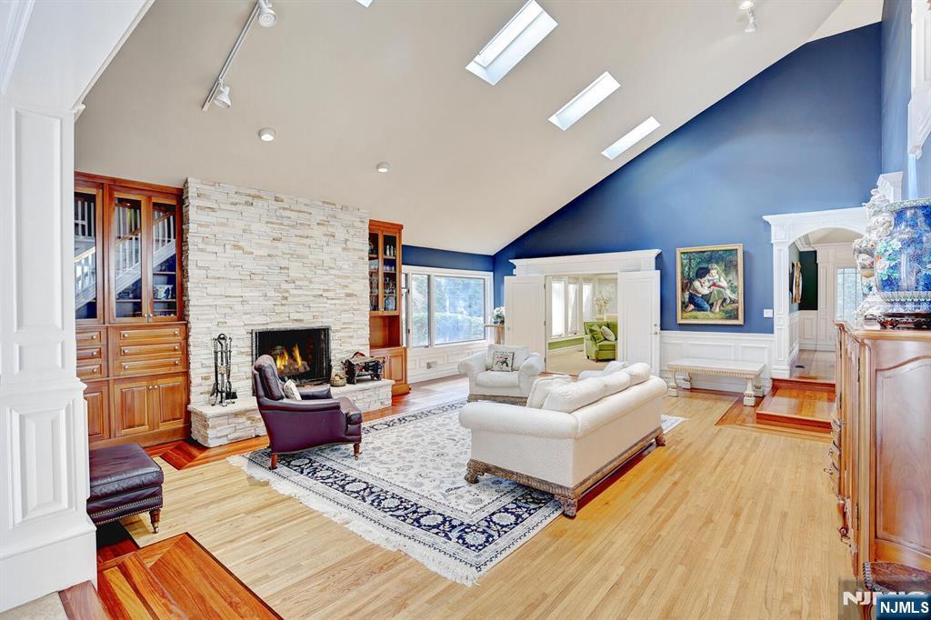 4 Summertree Way Montvale, NJ 07645 - Photo 4 of 50 a living room with furniture and a fireplace