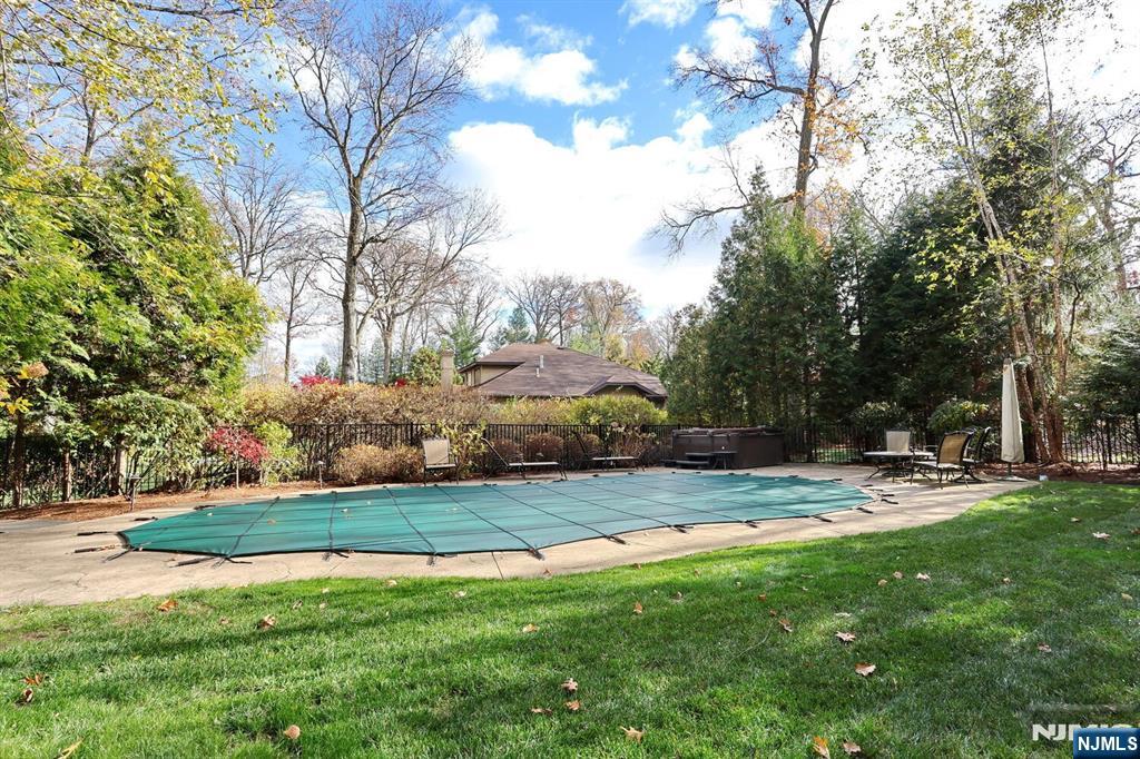 4 Summertree Way Montvale, NJ 07645 - Photo 42 of 50 a view of a backyard with a garden and trees