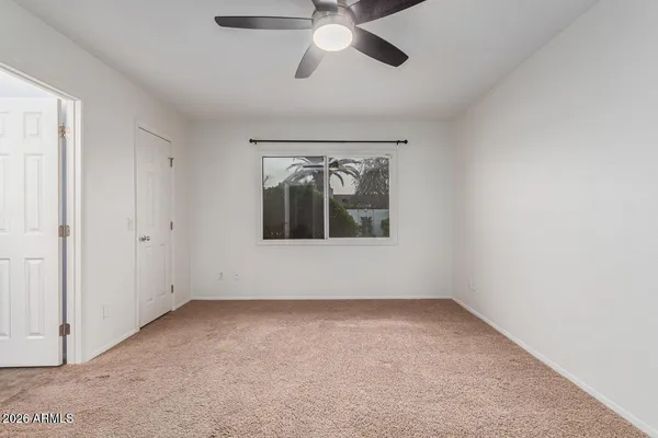 a view of an empty room with a window