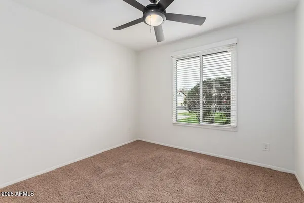 an empty room with closet area