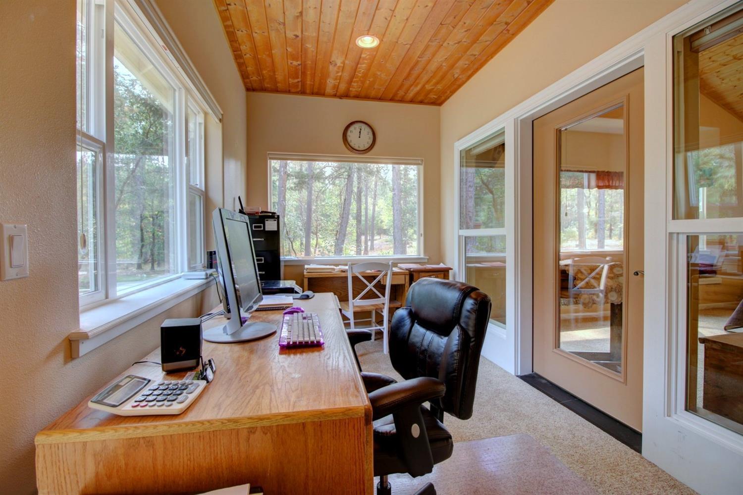 1065 Riessen Road Grants Pass, OR 97526 - Photo 13 of 32 a view of a livingroom with workspace and a window
