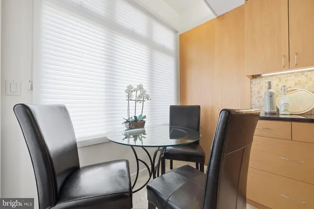 a bedroom with a bed and a television