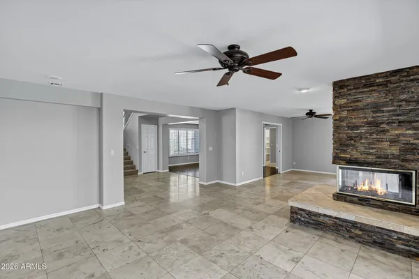 a kitchen with stainless steel appliances granite countertop sink stove and refrigerator