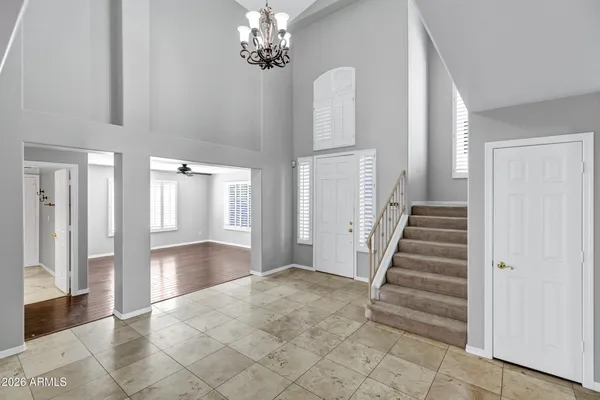 a view of wooden floor and windows in a room