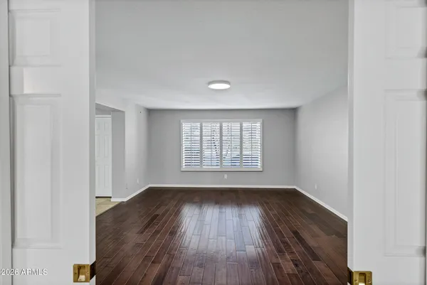 an empty room with a ceiling fan