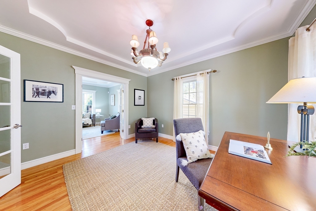 99 Ridge Street Winchester, MA 01890 - Photo 13 of 40 a living room with furniture and a chandelier