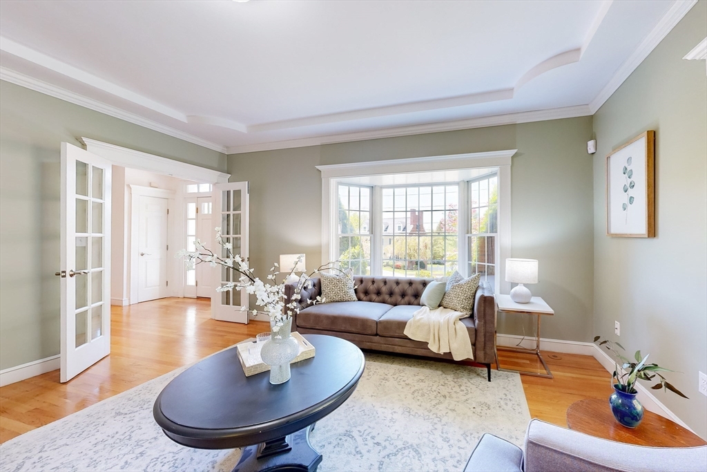 99 Ridge Street Winchester, MA 01890 - Photo 15 of 40 a living room with furniture and a large window