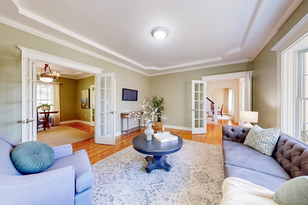 99 Ridge Street Winchester, MA 01890 - Photo 16 of 40 a living room with furniture a rug and a large window
