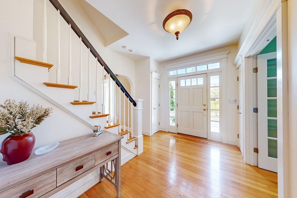 99 Ridge Street Winchester, MA 01890 - Photo 18 of 40 a view of an entryway with wooden floor and staircase