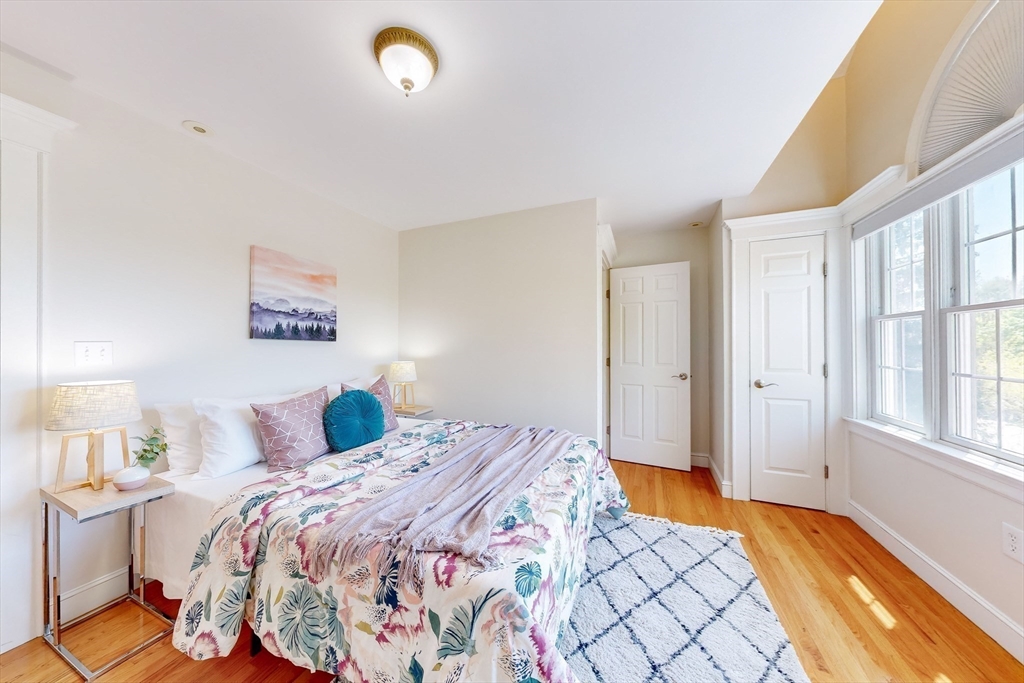 99 Ridge Street Winchester, MA 01890 - Photo 24 of 40 a bedroom with a bed and a window