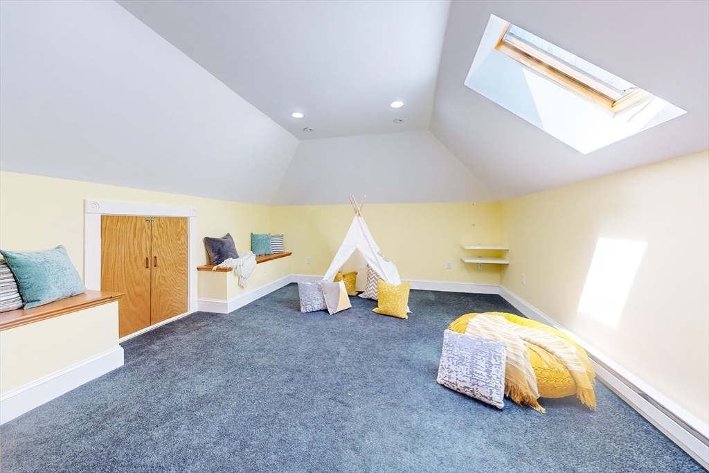 99 Ridge Street Winchester, MA 01890 - Photo 27 of 40 a living room with furniture and a table