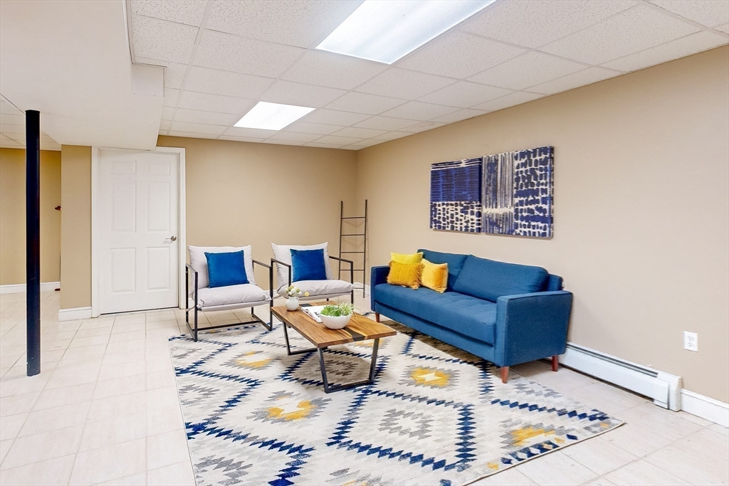 99 Ridge Street Winchester, MA 01890 - Photo 28 of 40 a living room with furniture and a rug