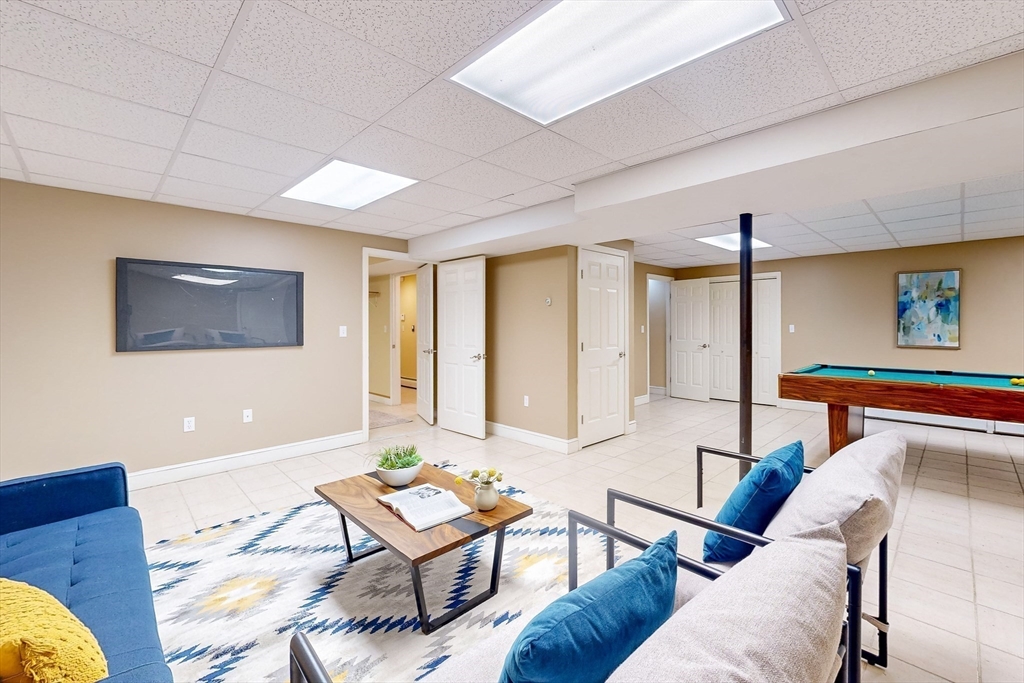 99 Ridge Street Winchester, MA 01890 - Photo 29 of 40 a living room with furniture and a window