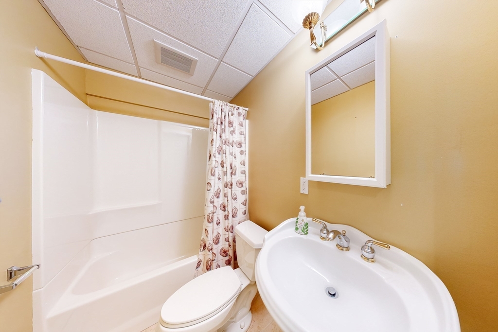 99 Ridge Street Winchester, MA 01890 - Photo 32 of 40 a bathroom with a sink toilet and shower