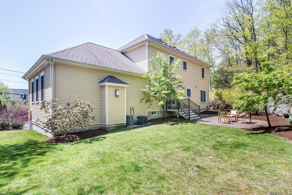 99 Ridge Street Winchester, MA 01890 - Photo 38 of 40 a front view of a house with garden