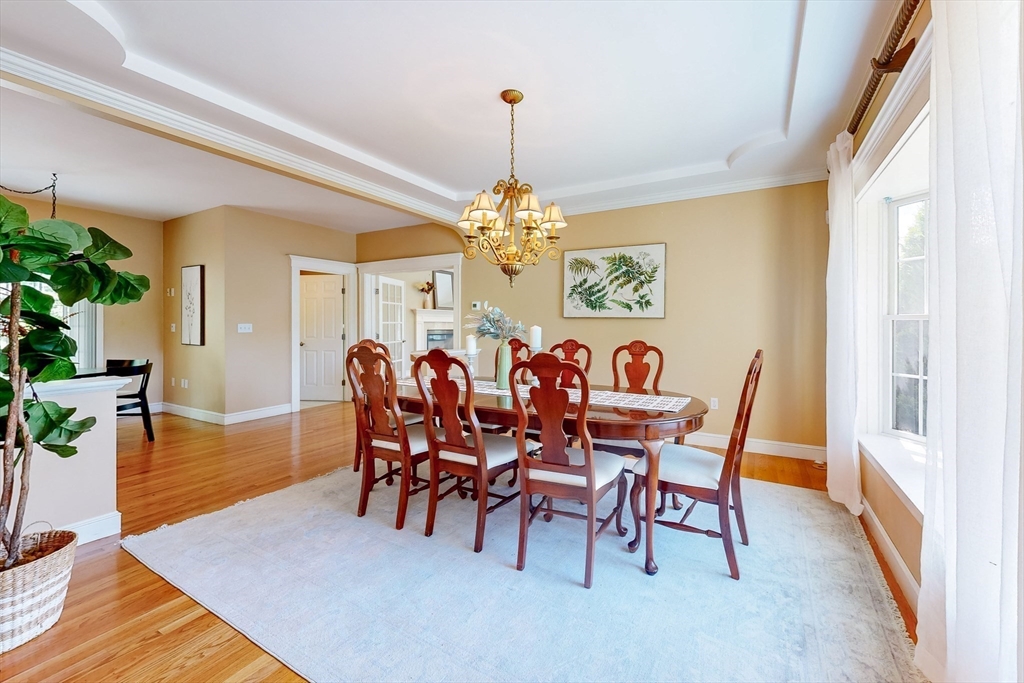 99 Ridge Street Winchester, MA 01890 - Photo 6 of 40 a view of a dining room with furniture and chandelier