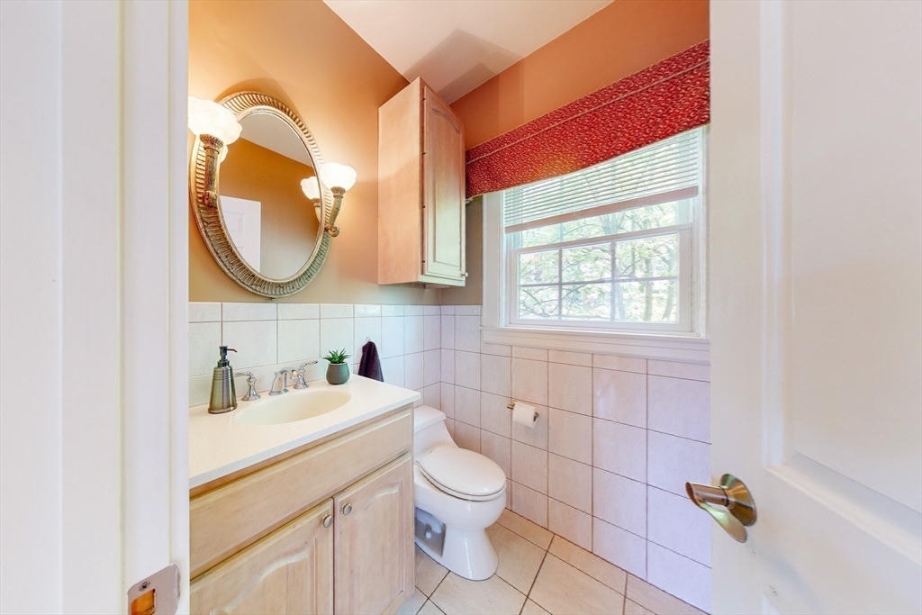 99 Ridge Street Winchester, MA 01890 - Photo 8 of 40 a bathroom with a sink a vanity and a mirror