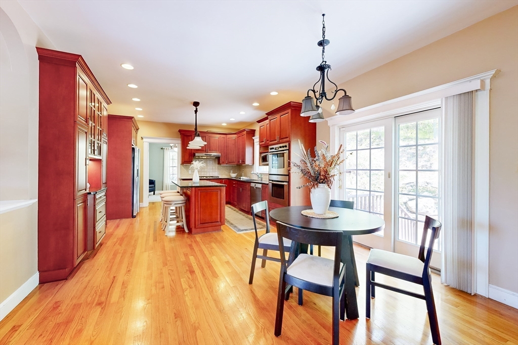 99 Ridge Street Winchester, MA 01890 - Photo 9 of 40 a dining room with furniture and wooden floor