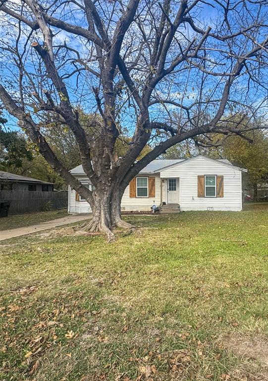 3206 Mitchell Street Greenville, TX 75402 - Photo 2 of 24 a house with trees in front of it