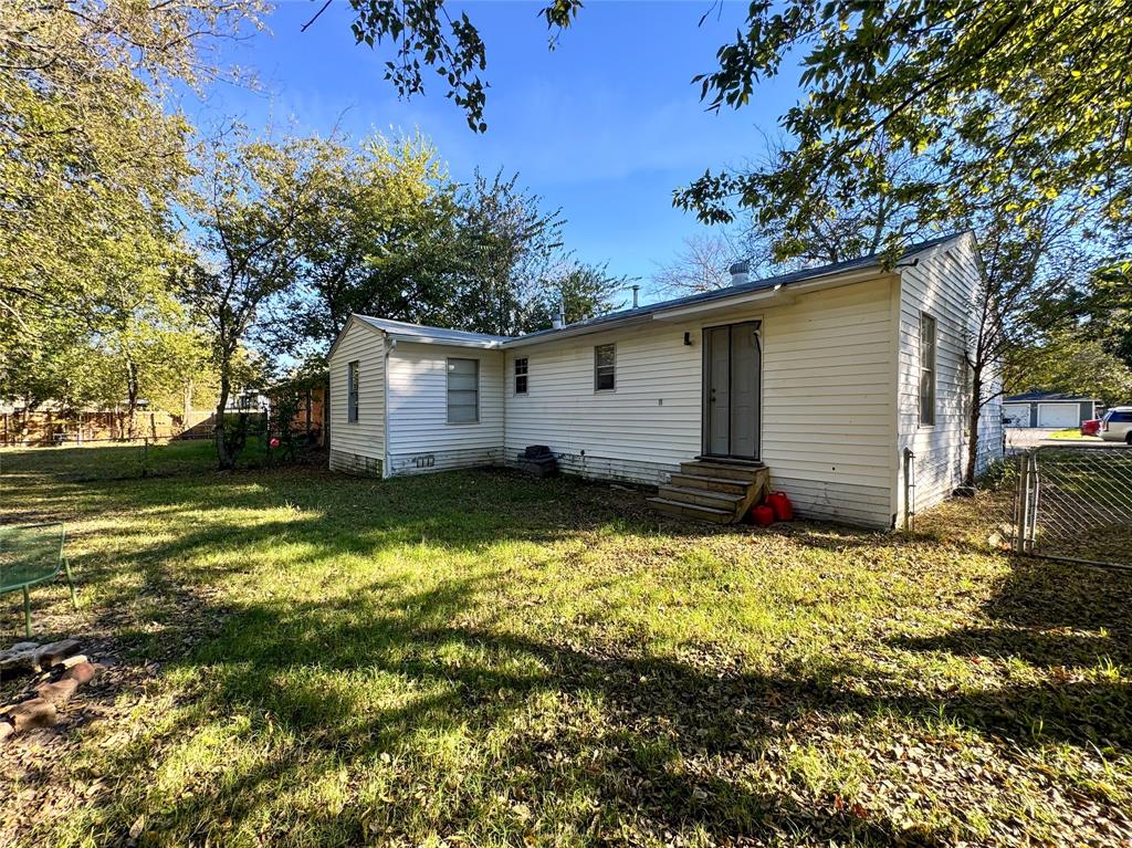 3206 Mitchell Street Greenville, TX 75402 - Photo 22 of 24 a view of house with backyard