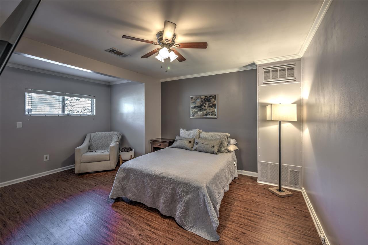4680 Flamingo Road Memphis, TN 38117 - Photo 11 of 23 a bedroom with a bed and wooden floor