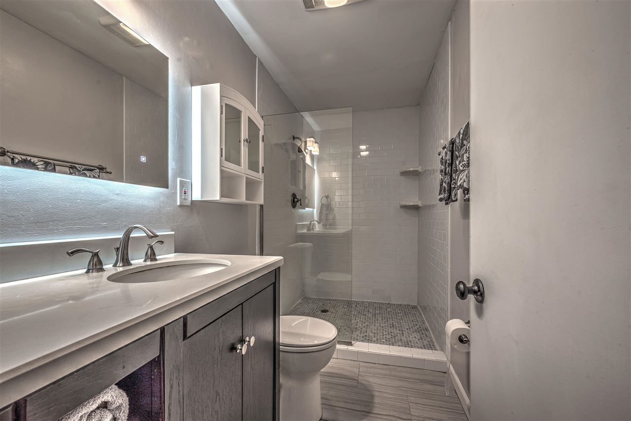 4680 Flamingo Road Memphis, TN 38117 - Photo 14 of 23 a bathroom with a sink toilet and shower