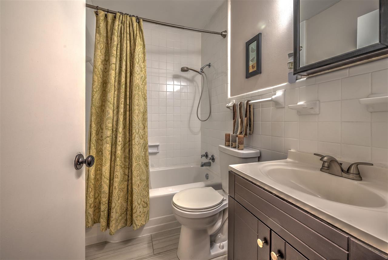 4680 Flamingo Road Memphis, TN 38117 - Photo 17 of 23 a bathroom with a sink a toilet and shower
