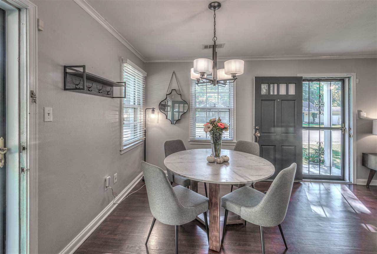 4680 Flamingo Road Memphis, TN 38117 - Photo 7 of 23 a view of a dining room with furniture wooden floor and chandelier