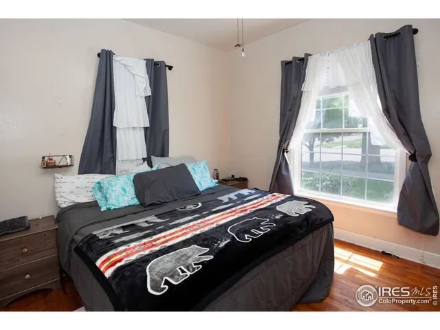 a living room with furniture and large window