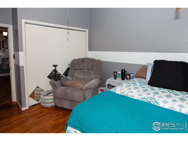 a view of a room with wooden floor and cabinet