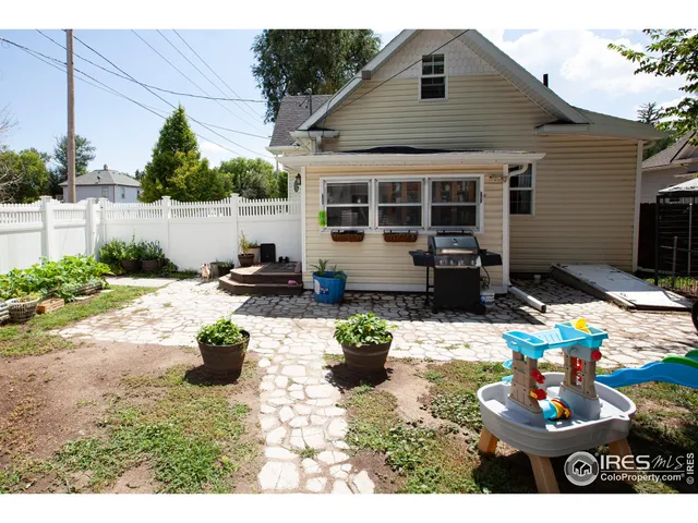 a view of a backyard with a patio