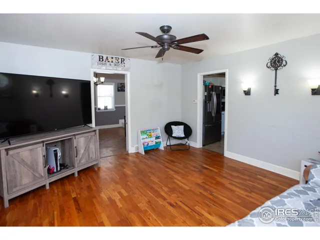 a view of an empty room with a flat screen tv