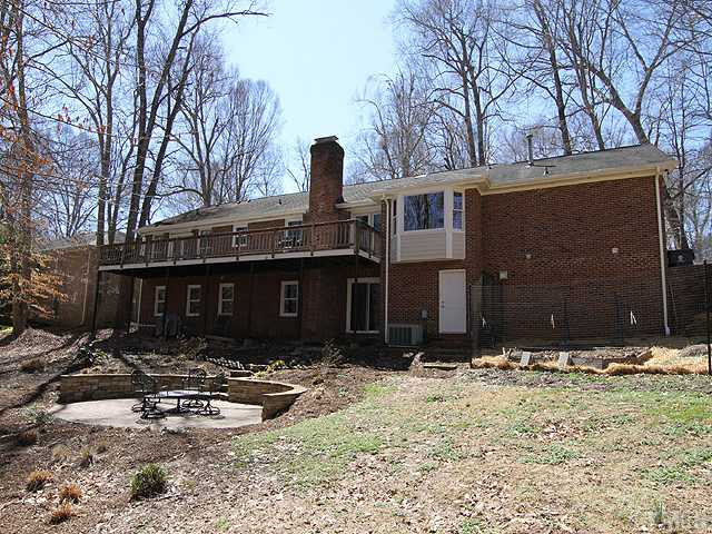 8644 Valley Brook Drive Raleigh, NC 27613 - Photo 18 of 18 BACKVIEW OF HOME: Just waiting for spring and it's new owner! Tons of storage space in the partially unfinished basement t or room to add another bedroom and still have storage space!