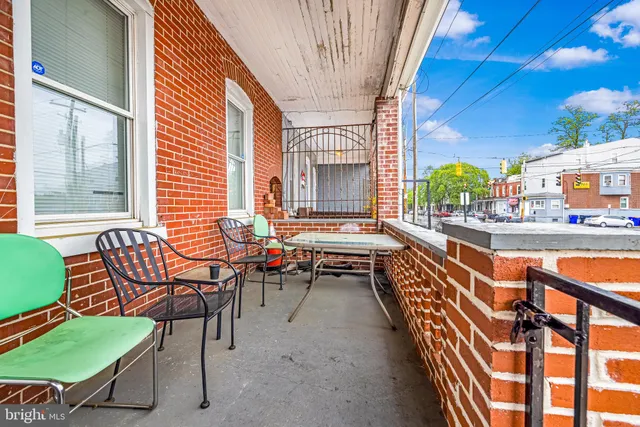 a living room with furniture and a ceiling fan