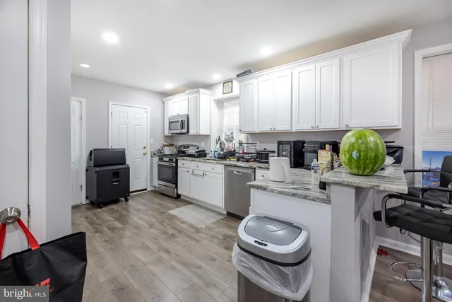 a living room with furniture and flat screen tv