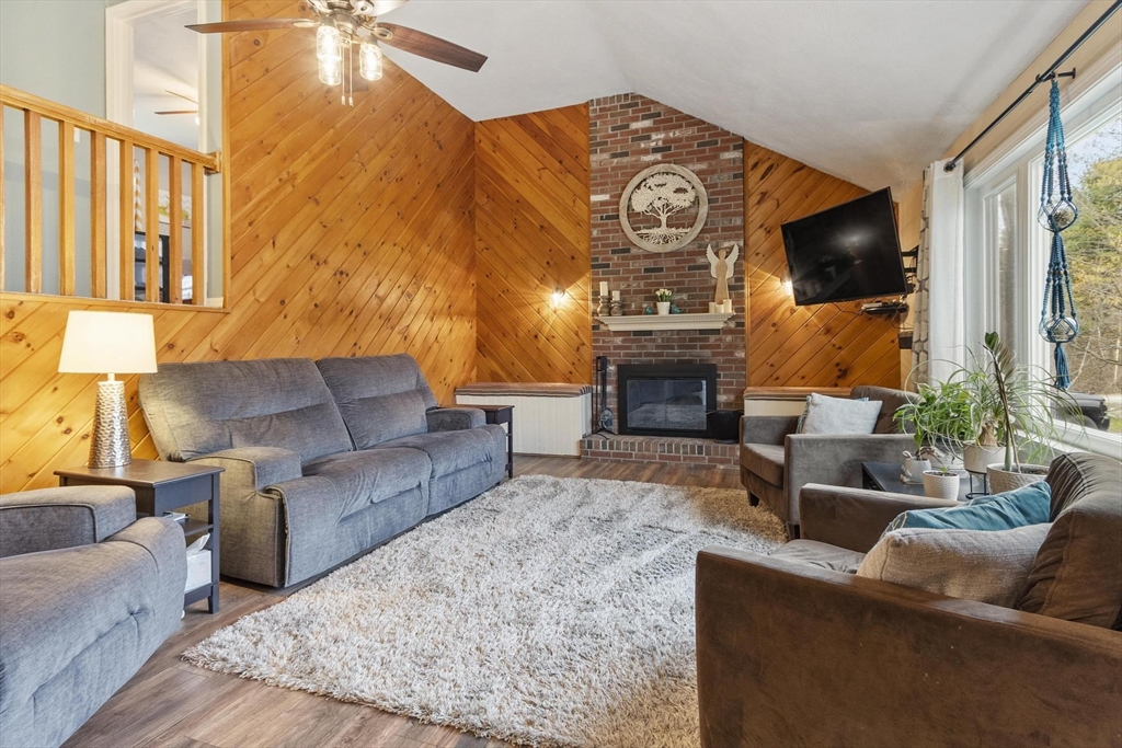 101 Williams Road Ashburnham, MA 01430 - Photo 13 of 42 a living room with fireplace furniture and a flat screen tv
