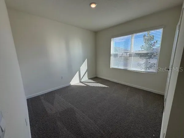 a bathroom with a double vanity sink and mirror with shower