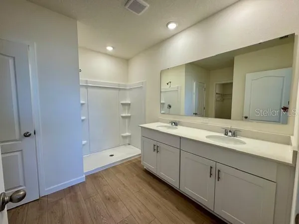 a bathroom with a shower and toilet