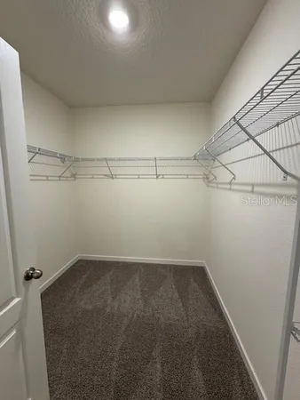 a view of a room with storage and utility room