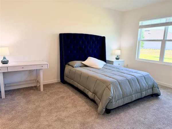 a bathroom with a sink toilet a mirror and shower