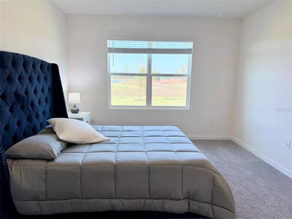 a bathroom with a granite countertop toilet and a shower