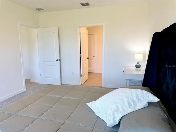 a bathroom with a double vanity sink and mirror with shower