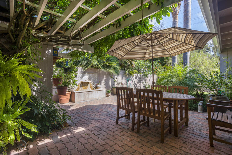 2123 Sycamore Canyon Road Montecito, CA 93108 - Photo 14 of 21 a patio with a patio table and chairs