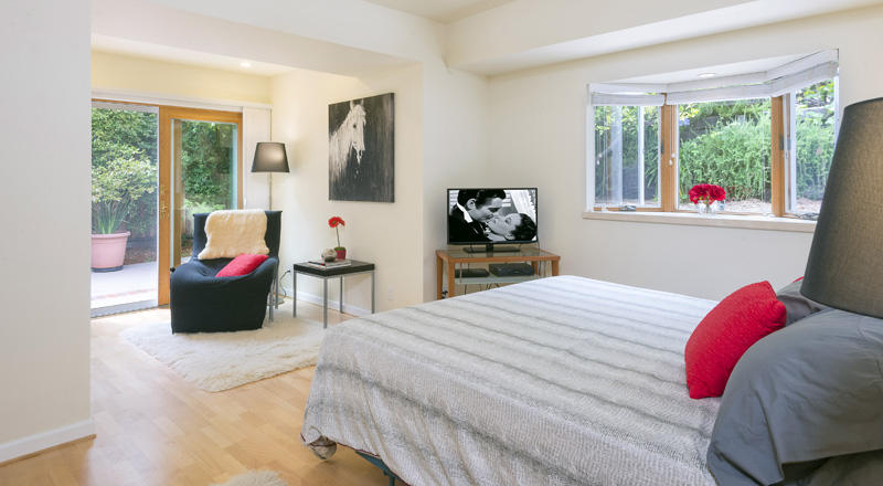 2123 Sycamore Canyon Road Montecito, CA 93108 - Photo 9 of 21 a bedroom with a bed and glass window