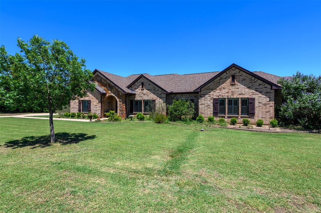 12470 Plainview Road Krum, TX 76249 - Photo 1 of 1 a front view of a house with a yard