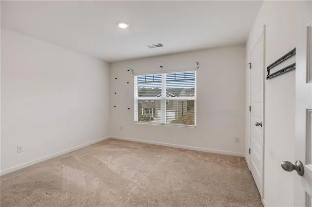 a view of empty room with windows