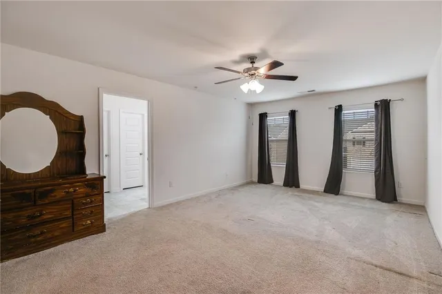 a view of an empty room with a dresser